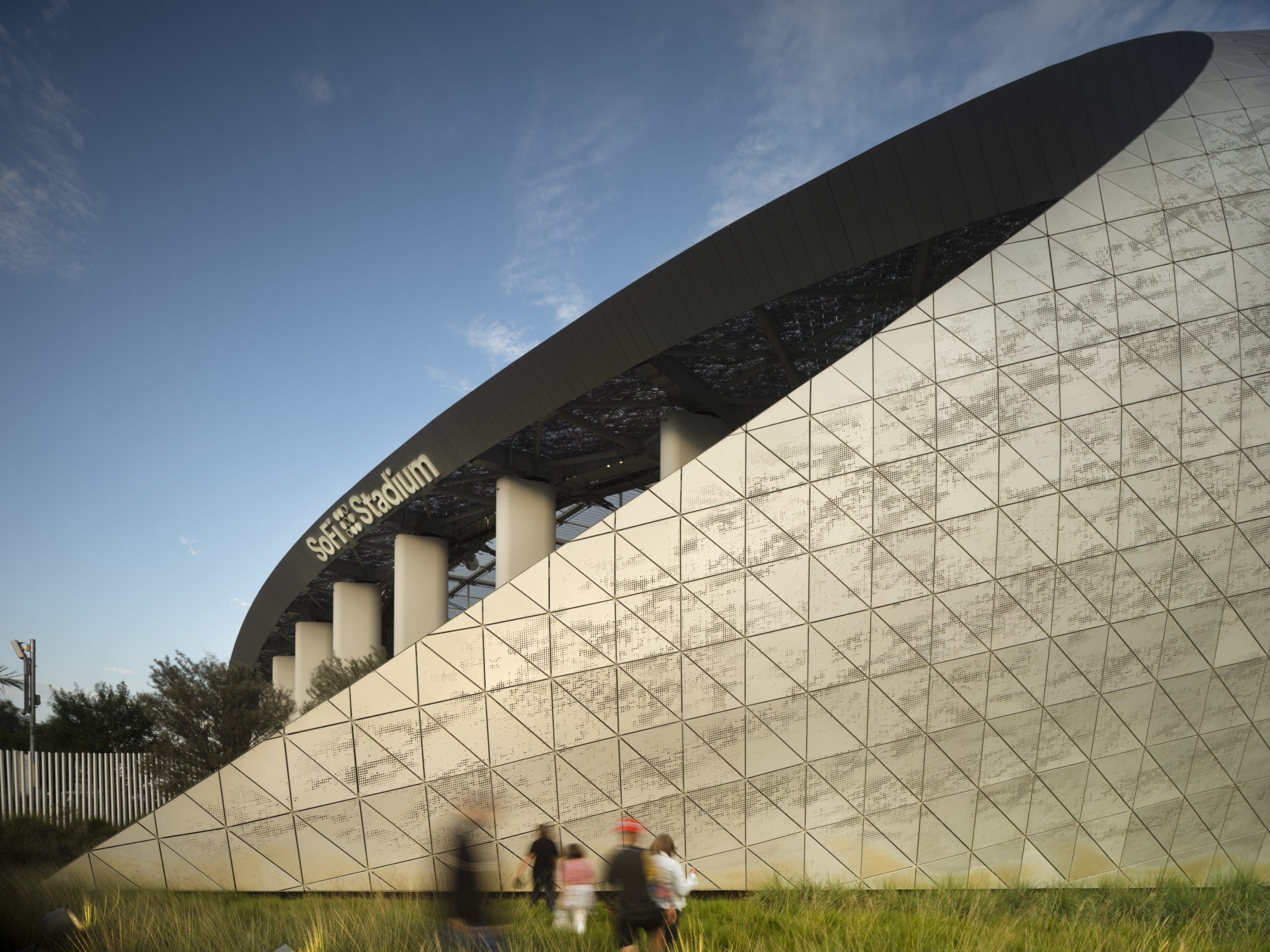 HKS designed a unique canopy and skin for SoFi Stadium featuring custom-perforated anodized aluminum panels from Zahner.