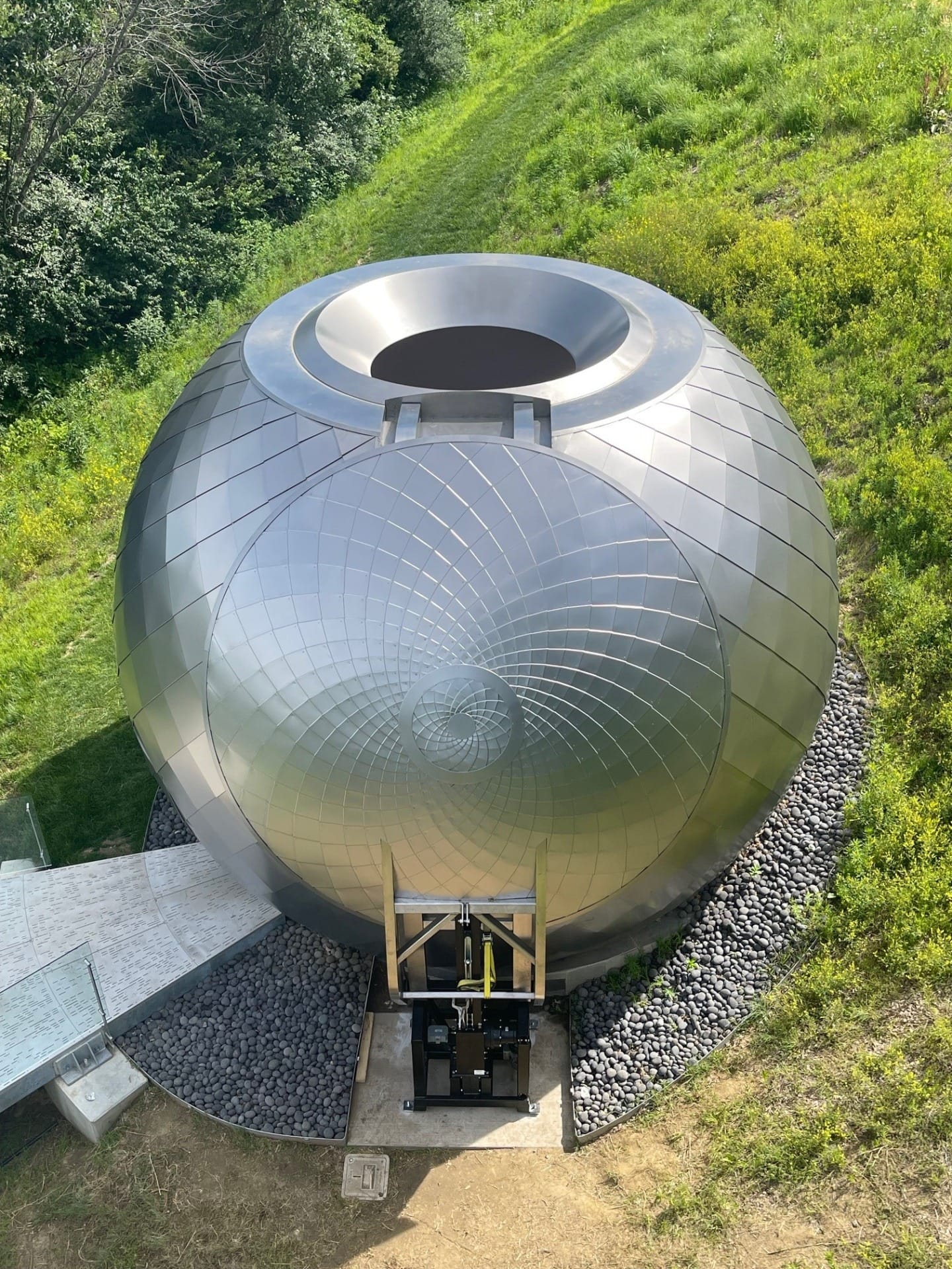 The 14' dual-curved oculus cover features intricate patterning rendered with Angel Hair panels.