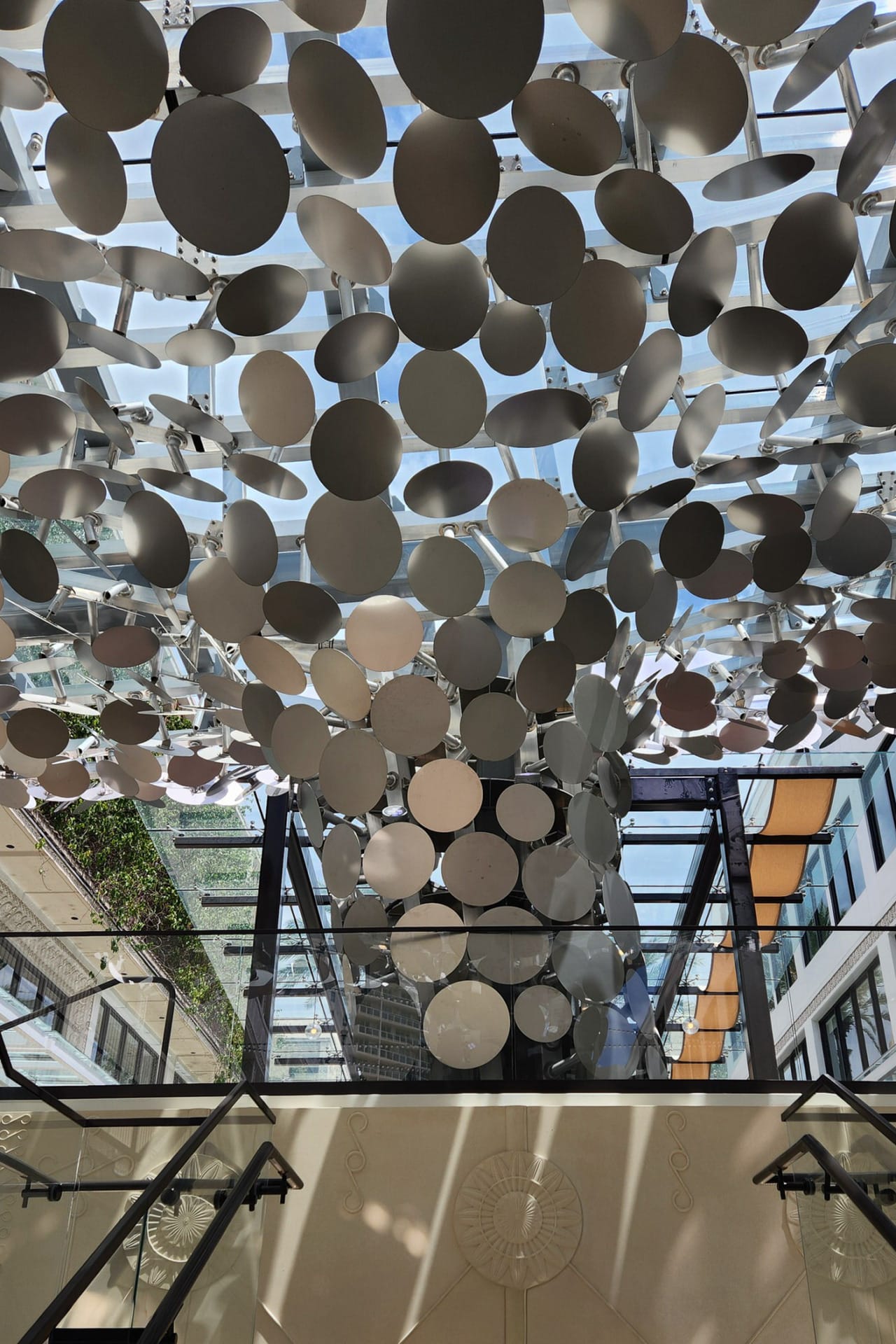 Sculptural canopy for Mayfair at the Grove in Miami, designed by Zahner and Gensler in Angel Hair® stainless steel. View of the canopy from below.